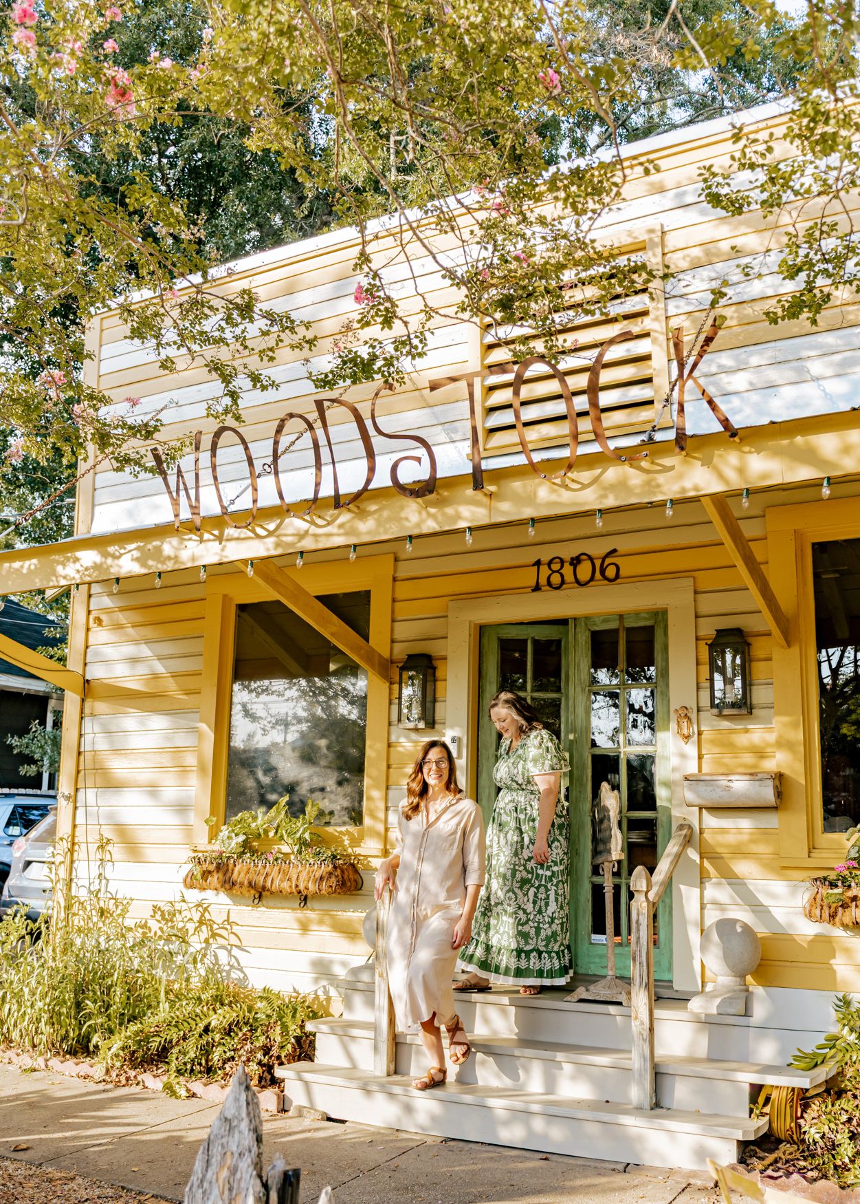 Cristy and Erica on the front porch of Woodstock at 1806 N 3rd Street